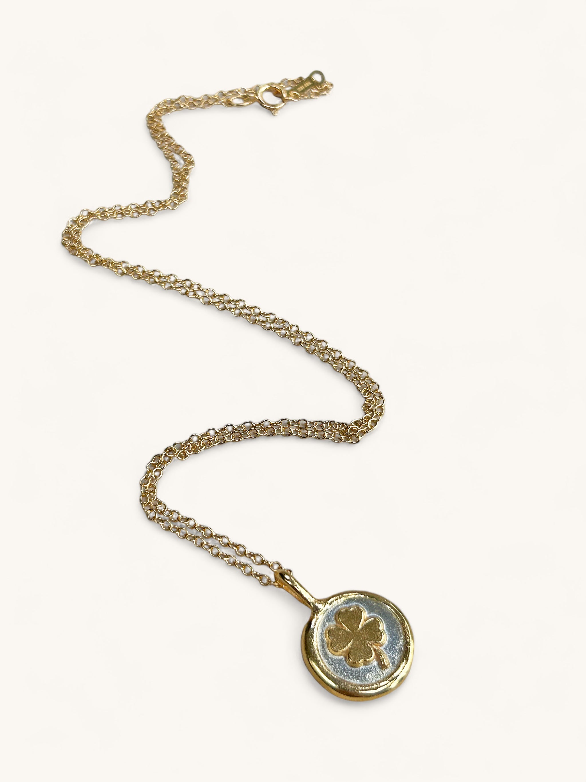 Jennifer Loiselle four leaf clover necklace in recycled silver and gold