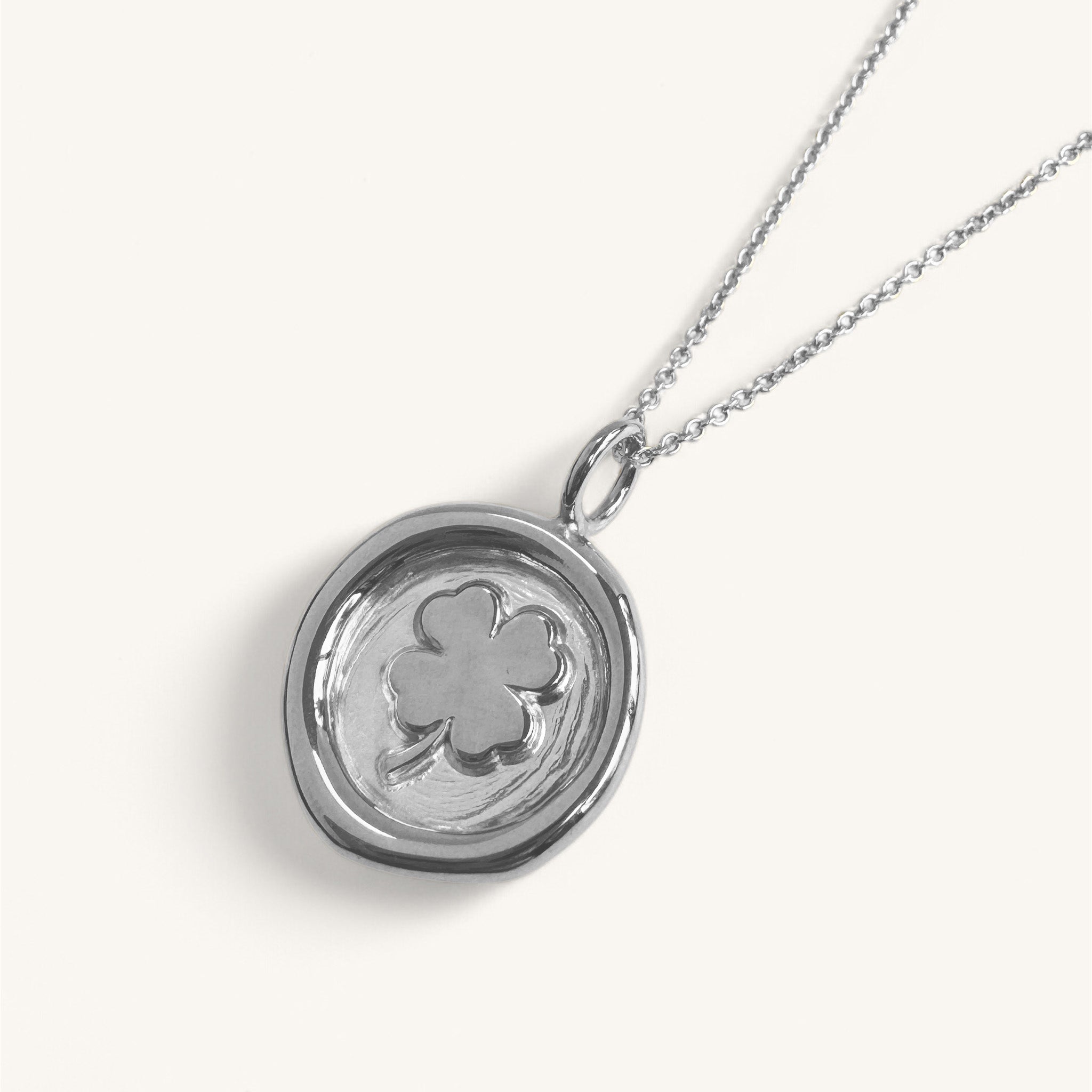 Jennifer Loiselle four leaf clover necklace in recycled silver and gold