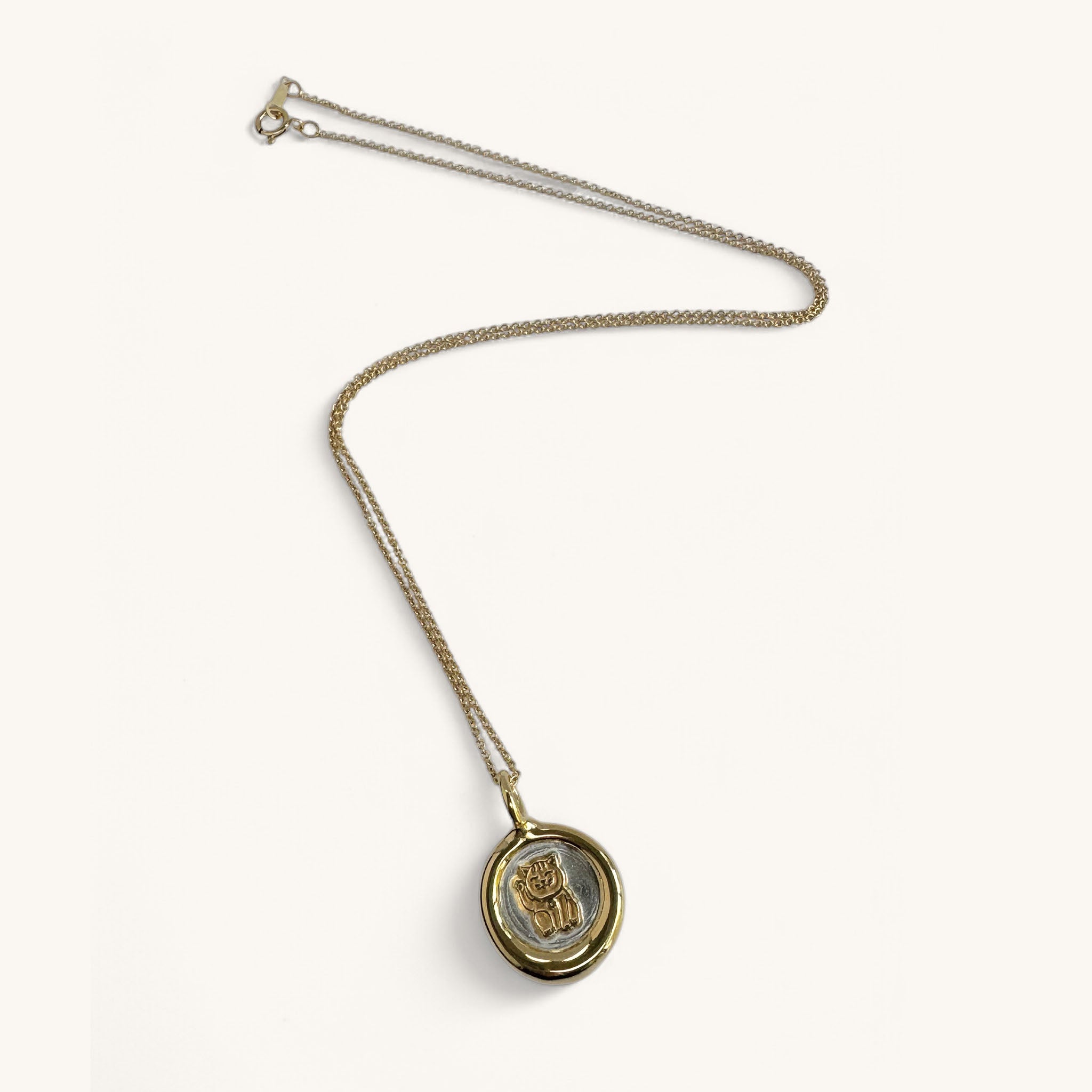 Jennifer Loiselle Lucky Cat Necklace in silver and gold vermeil